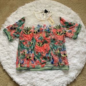 White sheer top with colorful floral detail